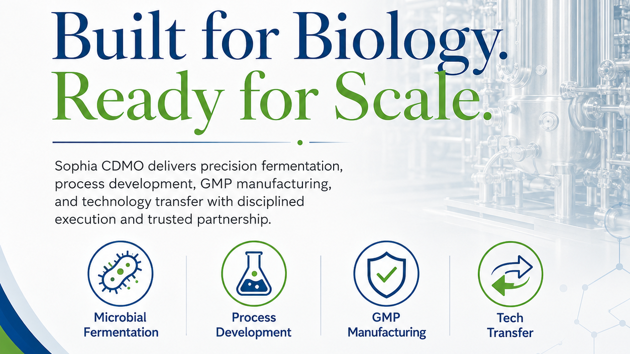 Ad says “Built for Biology. Ready for Scale.” and icons for microbial fermentation, process development, GMP manufacturing, and technology transfer against a clean stainless-steel bioreactor background.