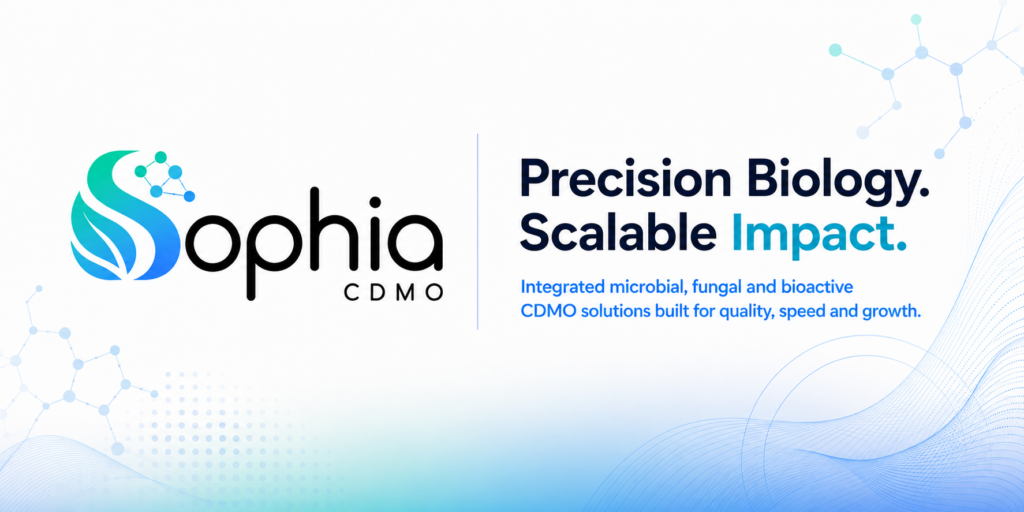 Wide white Sophia CDMO banner with an integrated blue-to-teal S wordmark, bold navy headline “Precision Biology. Scalable Impact.” and subtle molecular, dotted, and flowing-wave graphics.